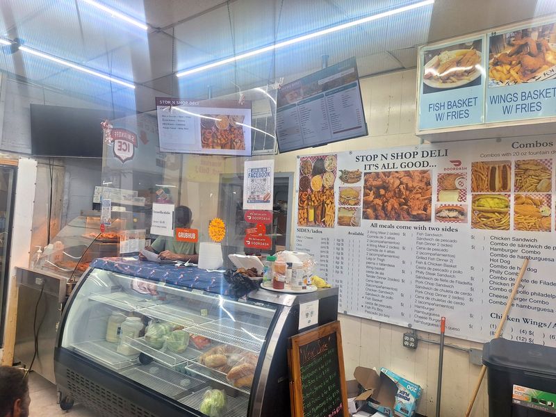The hot deli counter and menu boards inside Stop N Shop Deli